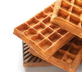 Board with tasty Belgian waffles on white background, closeup