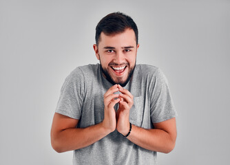 Young man in the studio on a gray background