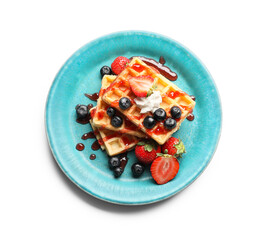 Plate of tasty Belgian Waffles with berries on white background