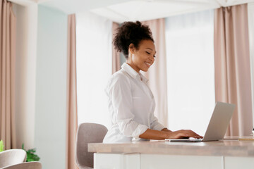 The student is chatting with friends. Shopping is convenient in the online store.  The hostess is...