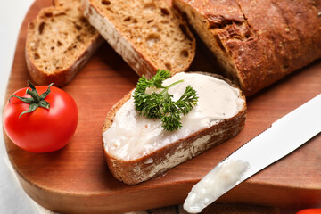 Bread with lard spread on wooden board