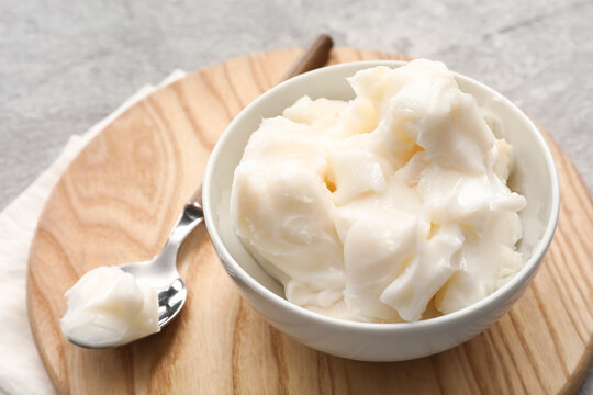Bowl of lard spread on grey background