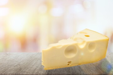 Emmental cheese triangle, Swiss cheese on the desk