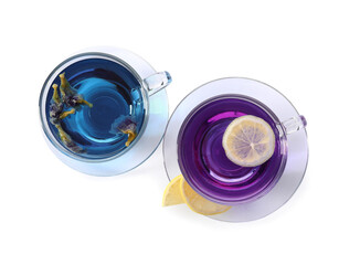Cups of butterfly pea flower tea on white background