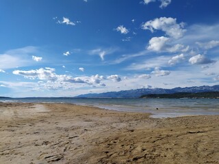 Beautiful scenic view from sand beach near Zadar, Croatia, looking on Pag peninsula and Velebit...