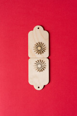 retro wooden tags with laser cut starburst shapes on red paper