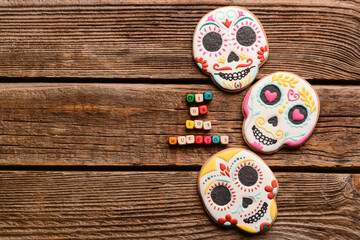 Skull shaped cookies for Mexico's Day of the Dead (El Dia de Muertos) on wooden background