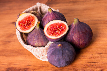 Organic Sweet fig fruit healthy vegan vegetable diet food fresh ripe red cut slide in half tasty...