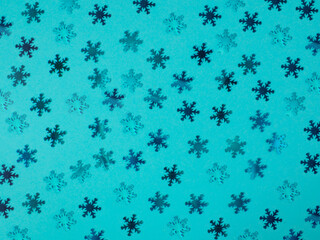 Background from blue snowflakes. Blue background.