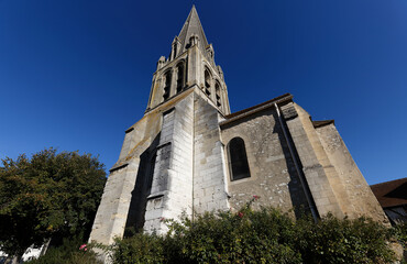 Fototapeta na wymiar old stone Catholic church Saint Aubin in French village Limay, France.
