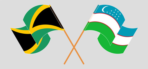 Crossed and waving flags of Jamaica and Uzbekistan