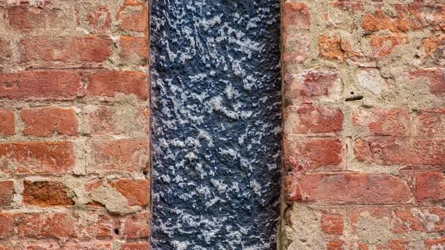 The abstract digital animation of an illusory motion effect on the brick wall.
