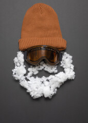 Imitation of the head of a bearded skier and snowboarder. Funny layout composition