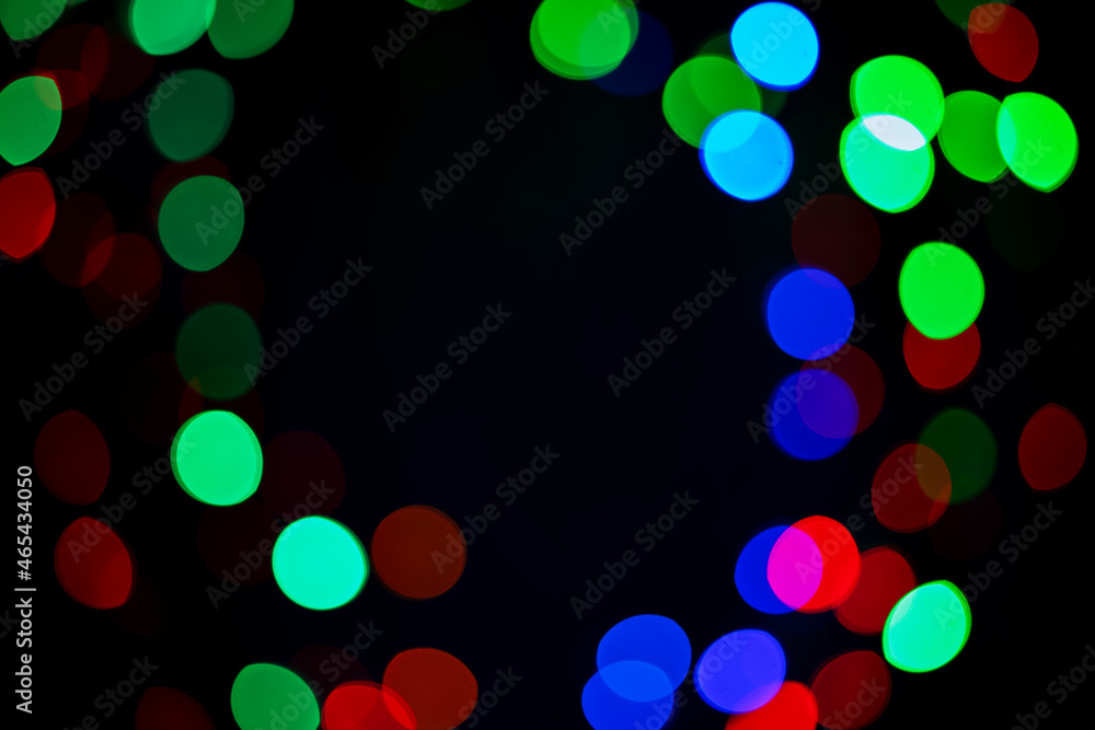 Poster dark fancy background with multicolored bokeh and clear space in the middle. decorative frn with a t
