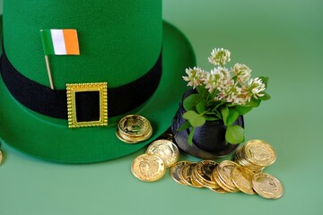 St.Patrick 's Day.Green leprechaun hat, flag of Ireland, bowler hat with gold coins, clovers on a...