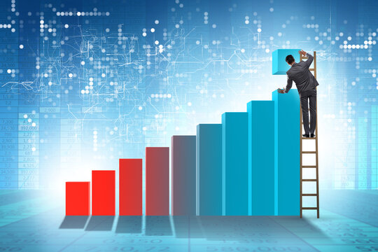 Businessman supporting economic growth on chart