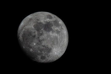 A black and white photograph of the Moon.
