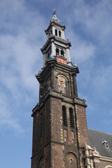 Fototapeta na wymiar a historical clock tower and winter blue sky in amstedam