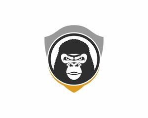 Gorilla head in the shield protection logo