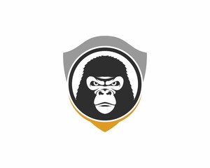 Gorilla head in the shield protection logo