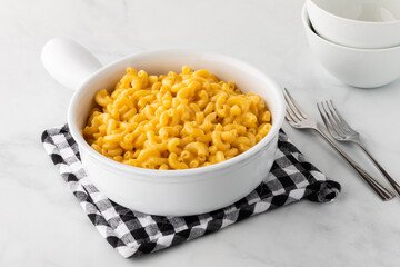 A large casserole dish of homemade macaroni and cheese ready for serving.