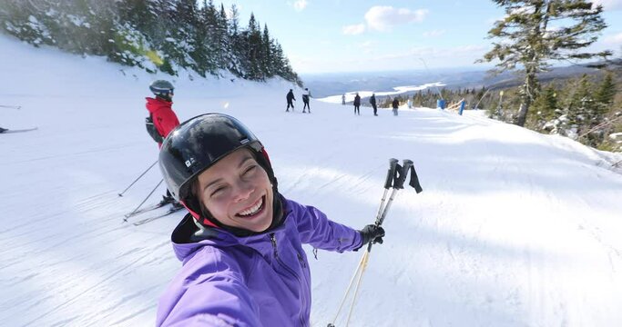 Ski Selfie Video by woman going skiing on ski holidays vacation in mountains, Winter landscape with snow. Happy girl excited living healthy outdoors lifestyle