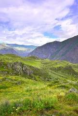 Altai mountains under a cloudy blue sky