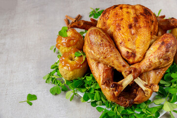 Holiday roasted turkey garnished with caramel apples and clover leaves.