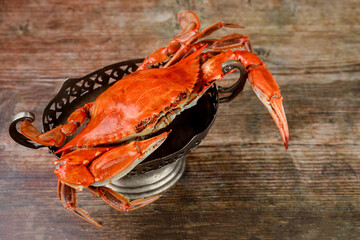 Cooked red crab on wooden background. Seafood.