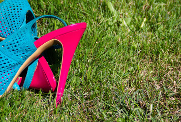 bright pink heels on green grass