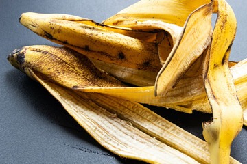banana skins on a black background