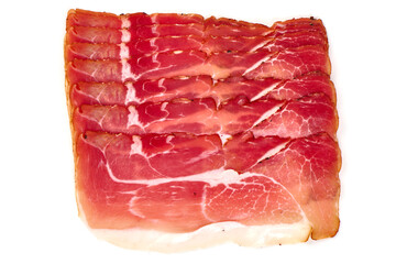 Dry cured jamon, serrano ham slices, isolated on white background.