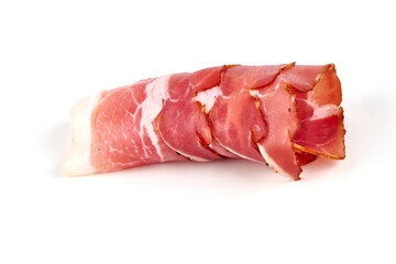 Dry cured jamon, serrano ham slices, isolated on white background.