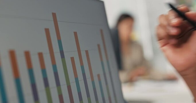 Close-up of computer monitor bar graph displayed dark-skinned man's hand holding pen touche screen with it checks diagram levels their correctness height statistics bureau marketing financial analysis
