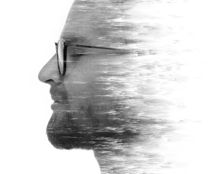 A portrait of a young man combined with a pixelsort effect in a double exposure technique