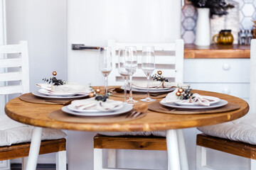 Festive New Year setting on the kitchen table for 4 persons