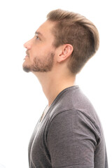 Obraz premium Portrait of a young man with a fashionable haircut on a white background