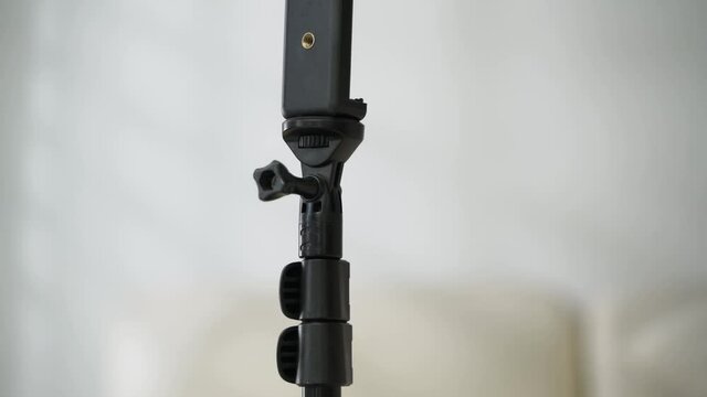 zoom out black tripod with white background