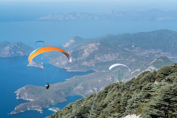 Paragliding parachuting is an extreme and fun sport. Paragliders jumping from Babadag. 21. Ölüdeniz International Air Games. Fethiye – TURKEY