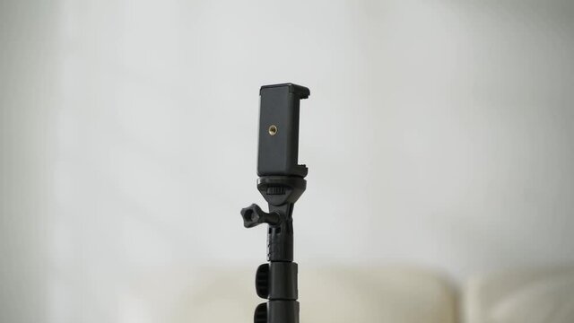 zoom in black tripod with white background