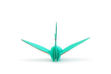 Origami crane isolated over white studio background.