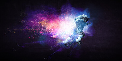 Obraz na płótnie Canvas Astronaut at spacewalk . Mixed media