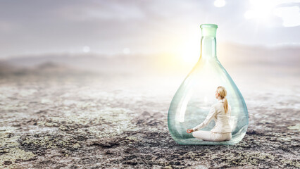 Business woman doing yoga in lotus pose inside glass bottle . Mixed media