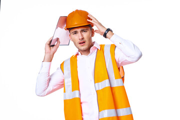 working man in orange uniform posing construction