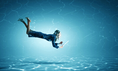 Woman with paper and pen underwater