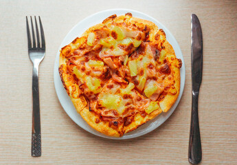 Close up of Pizza with pineapple,  mozzarella cheese, ham, bacon, pizza sauce. Sliced Hawaiian pizza texture, 