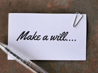 Phrase make a will written on white card with a pen.