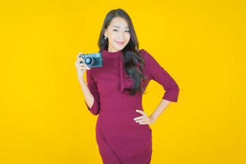 Portrait beautiful young asian woman use camera