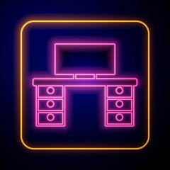 Glowing neon Office desk icon isolated on black background. Vector