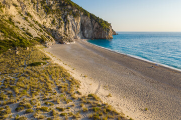 Aerial view of Milos beach near the Agios Nikitas village on Lefkada Ionian island, Greece. Evening sunset golden light